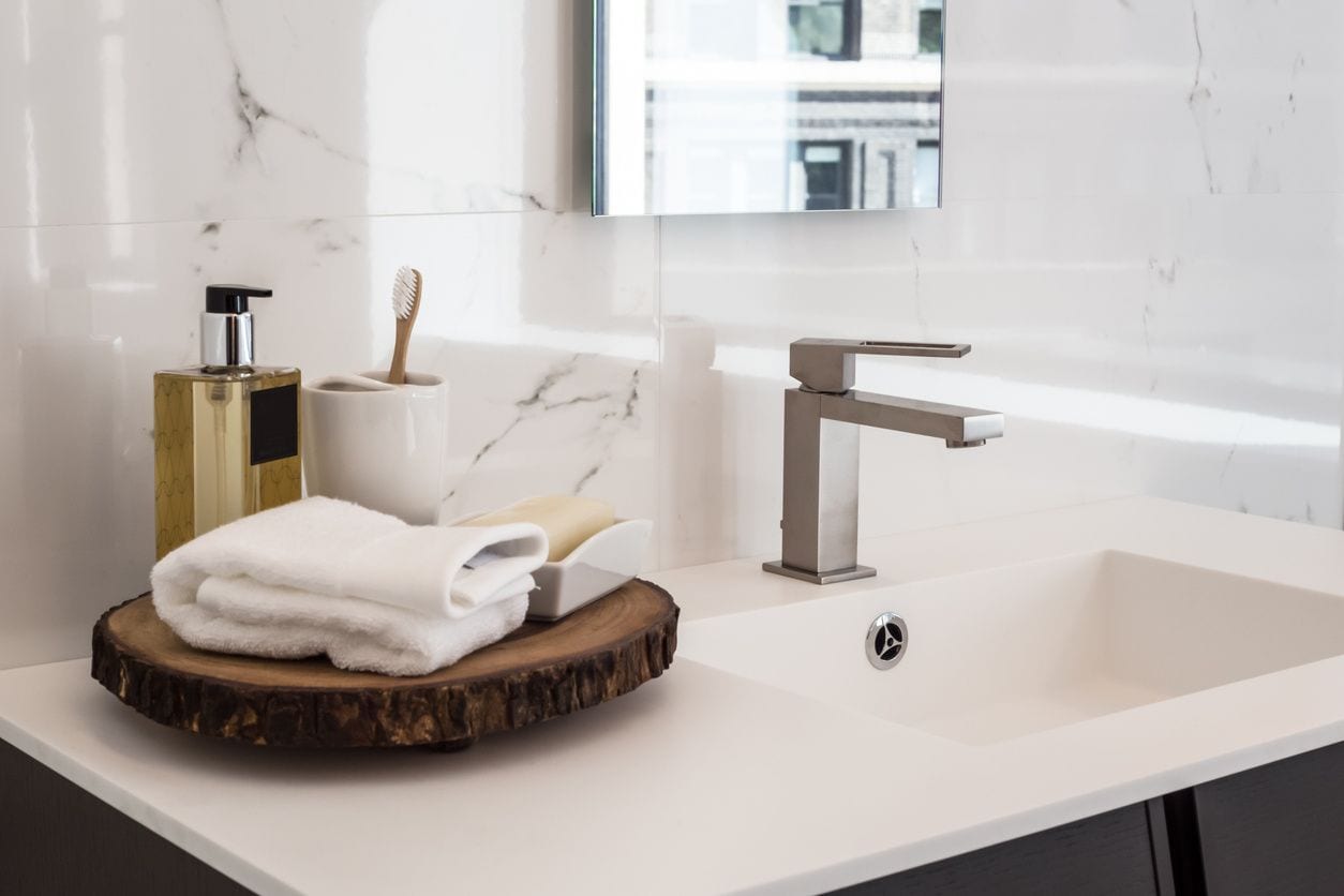 Sink with toiletries and hand soap dispenser
